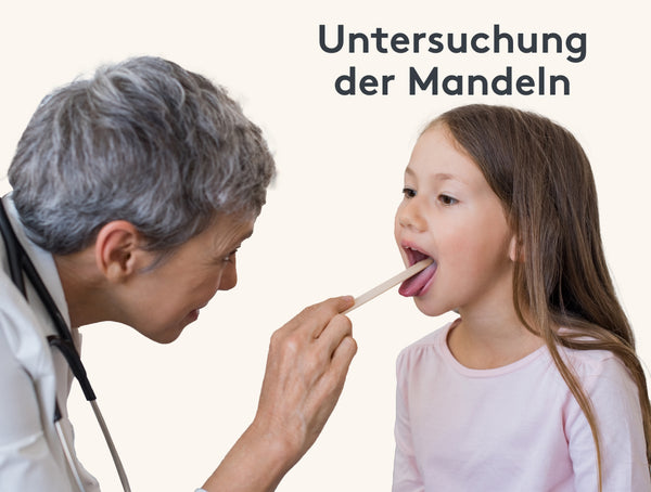 Ärztin untersucht die Mandeln eines Mädchens